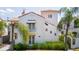Charming two-story home with red tile roof, balcony, and manicured landscaping, exudes Spanish-style charm at 53 Albemarle Ave, Tampa, FL 33606