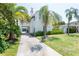 Stunning view of this unique Spanish-style home showcasing meticulous landscaping and a private driveway at 53 Albemarle Ave, Tampa, FL 33606