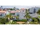 Charming Mediterranean-style home with a red tile roof and lush tropical landscaping at 53 Albemarle Ave, Tampa, FL 33606
