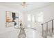 Bright foyer features tiled floor, modern light fixture, art and glass-topped table at 53 Albemarle Ave, Tampa, FL 33606