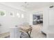 Open-concept home office featuring clean lines, minimalist decor, and a view into the adjoining kitchen space at 53 Albemarle Ave, Tampa, FL 33606