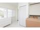Bright, airy room with closet, dresser, plantation shutters, and tiled floors at 53 Albemarle Ave, Tampa, FL 33606