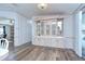 Dining area with glass front display cabinet and wood-look flooring at 5721 Apache St, Zephyrhills, FL 33542