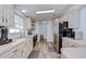 Bright kitchen with stainless steel appliances and plenty of cabinet space at 5721 Apache St, Zephyrhills, FL 33542