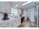 Open kitchen featuring plenty of natural light and modern stainless steel appliances at 5721 Apache St, Zephyrhills, FL 33542