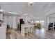 Open floor plan seamlessly connecting the kitchen and living room area at 5721 Apache St, Zephyrhills, FL 33542