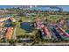 Scenic aerial view of the community showcasing lush landscaping, a tranquil pond, and easy access to the golf course at 6085 Bahia Del Mar Blvd # 106, St Petersburg, FL 33715