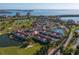 Expansive aerial view capturing a vibrant community set amidst lush greenery and scenic waterways at 6085 Bahia Del Mar Blvd # 106, St Petersburg, FL 33715