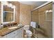 Bathroom featuring a glass shower, stone tile and granite countertop at 6085 Bahia Del Mar Blvd # 106, St Petersburg, FL 33715