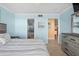 Comfortable bedroom with tiled floors and ensuite bathroom at 6085 Bahia Del Mar Blvd # 106, St Petersburg, FL 33715