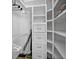 Organized closet interior with multiple shelves, drawers, and ample hanging space at 6085 Bahia Del Mar Blvd # 106, St Petersburg, FL 33715