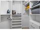 Organized walk-in closet with built-in shelving and ample storage space at 6085 Bahia Del Mar Blvd # 106, St Petersburg, FL 33715