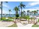 Scenic waterfront community with palm trees, lush lawns, and resort-style amenities at 6085 Bahia Del Mar Blvd # 106, St Petersburg, FL 33715