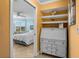 Hallway with view of the bedroom and built-in cabinets at 6085 Bahia Del Mar Blvd # 106, St Petersburg, FL 33715
