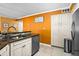 Bright kitchen featuring granite countertops, stainless steel appliances, and ample cabinet space at 6085 Bahia Del Mar Blvd # 106, St Petersburg, FL 33715