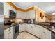 Well-equipped kitchen with stainless steel appliances, granite countertops, and ample cabinet space at 6085 Bahia Del Mar Blvd # 106, St Petersburg, FL 33715