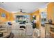 Bright living area with tile flooring, ceiling fan, comfortable seating, and a view to the outside at 6085 Bahia Del Mar Blvd # 106, St Petersburg, FL 33715