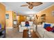Inviting living space featuring comfortable sofas, tile floors, and an open layout connecting to the kitchen at 6085 Bahia Del Mar Blvd # 106, St Petersburg, FL 33715