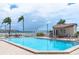 Large pool with crystal clear water, a pool house, plenty of seating and views of the bridge at 6085 Bahia Del Mar Blvd # 106, St Petersburg, FL 33715
