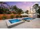 An inviting backyard pool and spa includes a covered seating area, cabana, and privacy fence at 6121 33Rd N Ave, St Petersburg, FL 33710