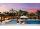 A beautiful backyard with a pool, spa, lounge chairs, and covered seating area offers lots of options at 6121 33Rd N Ave, St Petersburg, FL 33710