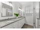 Bathroom with double vanities, granite countertops and a glass enclosed shower at 6121 33Rd N Ave, St Petersburg, FL 33710