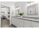 Bathroom with double vanities, granite countertops and ample storage space in white cabinets at 6121 33Rd N Ave, St Petersburg, FL 33710