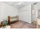 Bedroom featuring a decorative rug, brass crib, and a large window for ample natural light at 6121 33Rd N Ave, St Petersburg, FL 33710
