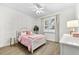 Bedroom with decorative wall trim, shuttered windows and wood-look tile flooring at 6121 33Rd N Ave, St Petersburg, FL 33710