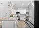 Well-equipped kitchen boasting stainless steel appliances, granite counters, and an island with bar stool seating at 6121 33Rd N Ave, St Petersburg, FL 33710