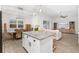 Open concept kitchen and dining area features pendant lighting, granite countertops and stainless steel appliances at 6121 33Rd N Ave, St Petersburg, FL 33710