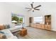 Bright living area featuring modern cabinets, tile flooring, and sliding glass doors with access to outdoor pool area at 6121 33Rd N Ave, St Petersburg, FL 33710