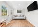 Cozy living room with a comfortable couch, television, and lots of natural light at 6121 33Rd N Ave, St Petersburg, FL 33710