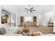 Spacious living room with tile flooring, entertainment center, ceiling fan, and access to the lanai at 6121 33Rd N Ave, St Petersburg, FL 33710
