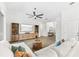 Open-concept living room with tile floors, a large sectional, and a view of the entertainment center at 6121 33Rd N Ave, St Petersburg, FL 33710