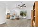 Open-concept living room with a large sectional, tile floors, and sliding glass doors that lead to the lanai at 6121 33Rd N Ave, St Petersburg, FL 33710