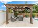 Beautiful pergola with outdoor seating, a fire pit, and a mounted television at 6121 33Rd N Ave, St Petersburg, FL 33710