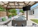 Backyard featuring an outdoor seating area, a fire pit, and a view of the pool and hot tub at 6121 33Rd N Ave, St Petersburg, FL 33710