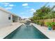 Beautiful pool with luxurious lounge chairs, landscaping, and an inviting outdoor seating area at 6121 33Rd N Ave, St Petersburg, FL 33710