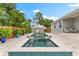 Inviting backyard with a sparkling pool, hot tub, lounge chairs and a spacious patio area at 6121 33Rd N Ave, St Petersburg, FL 33710