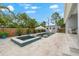 Inviting backyard with a sparkling pool, hot tub, a shed, and a spacious patio area at 6121 33Rd N Ave, St Petersburg, FL 33710