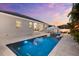 A luxury pool, a cabana, and outdoor living space with seating make this backyard perfect for entertaining at 6121 33Rd N Ave, St Petersburg, FL 33710