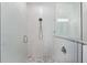Glass shower with mosaic tile flooring and updated fixtures in renovated Primary bathroom at 6121 33Rd N Ave, St Petersburg, FL 33710