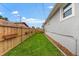 Green lawn along side of house with fence at 6121 33Rd N Ave, St Petersburg, FL 33710