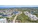 Scenic aerial view of waterfront homes, showcasing their proximity to canals and open water at 6121 Fjord Way, New Port Richey, FL 34652