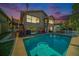 Backyard with a sparkling pool and a covered patio perfect for outdoor living at 6121 Fjord Way, New Port Richey, FL 34652