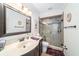 Updated bathroom with a glass-enclosed shower, vanity, and modern fixtures at 6121 Fjord Way, New Port Richey, FL 34652