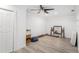 Empty bedroom with wood-look floors, ceiling fan and closet at 6121 Fjord Way, New Port Richey, FL 34652