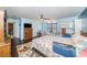 Bright bedroom featuring a large window, work area, and blue accent walls at 6121 Fjord Way, New Port Richey, FL 34652