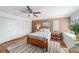 Charming bedroom features a ceiling fan, light brown accents, and an inviting atmosphere at 6121 Fjord Way, New Port Richey, FL 34652